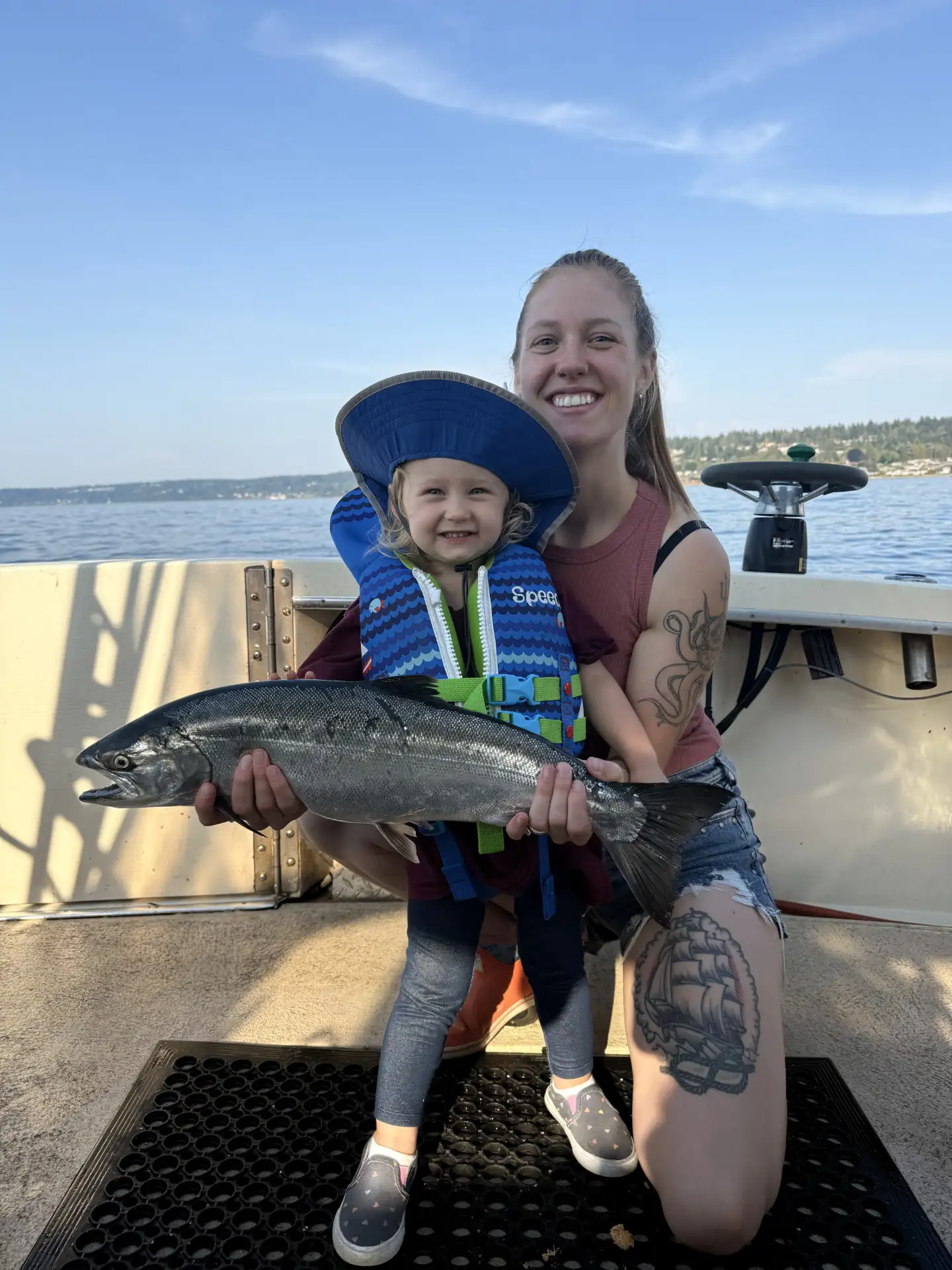 Family enjoying a private Puget Sound fishing charter near Seattle.
